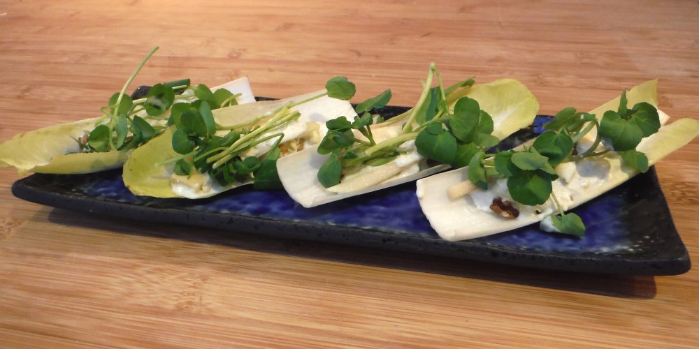 chicory leaves on a blue plate